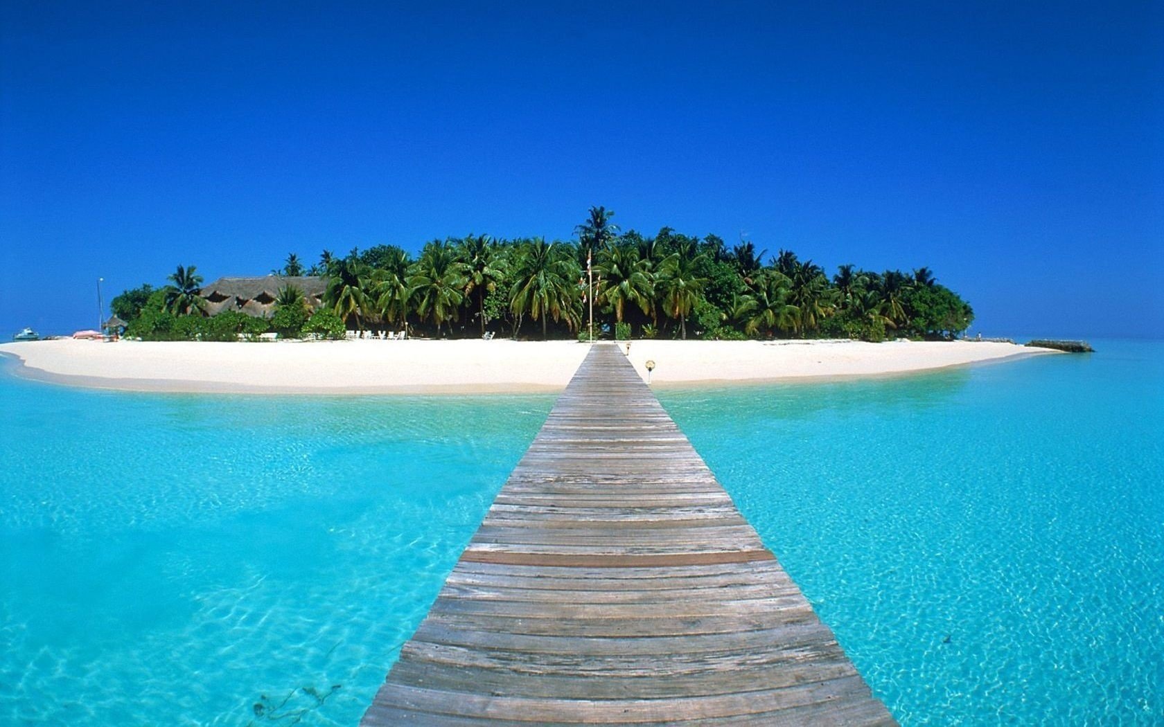 puente de madera playa casas agua cielo islas costa paraíso azul turquesa océano trópicos