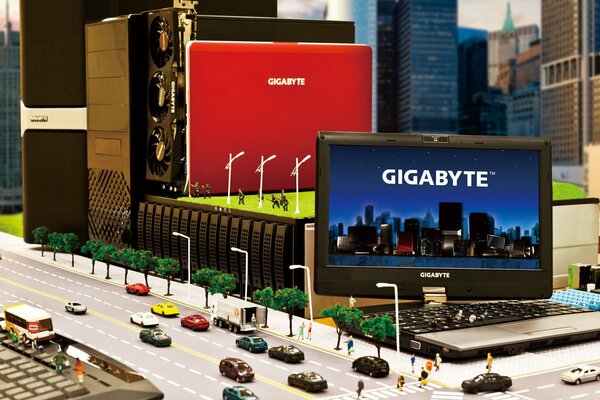 Publicidad del portátil gigabyte en miniatura con máquinas y personas