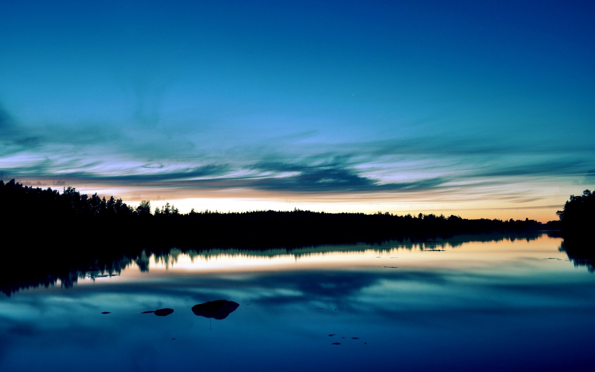 puesta de sol bosque lago