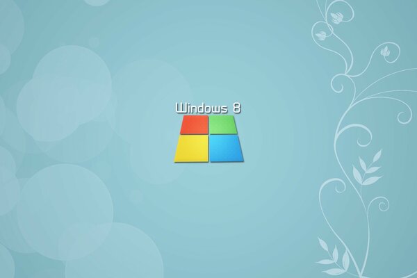 Icono de Windows multicolor sobre un fondo azul con patrones