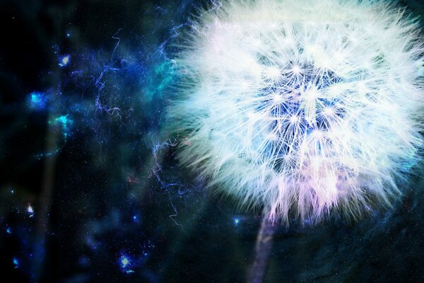 Diente de León como fuente de energía sobre un fondo azul