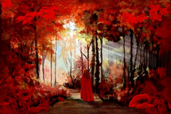Chica en una capa en el bosque rojo