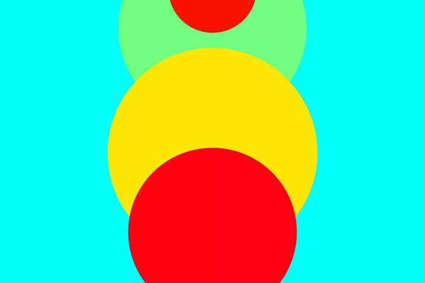 Sobre un fondo azul, un círculo rojo amarillo y verde