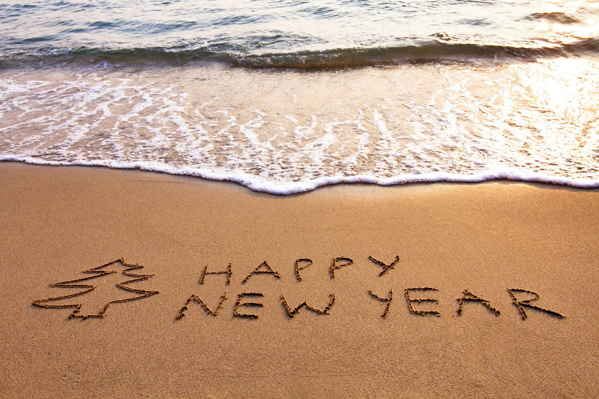 feliz año nuevo playa arena mar feliz año nuevo