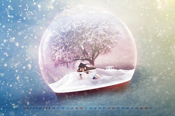 Casa cubierta de nieve en una bola de cristal