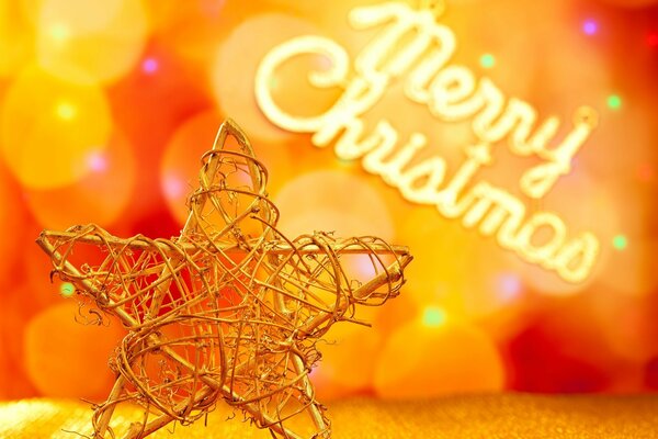 Juguete de Navidad de metal estrella con fondo bokeh y letras de feliz Navidad